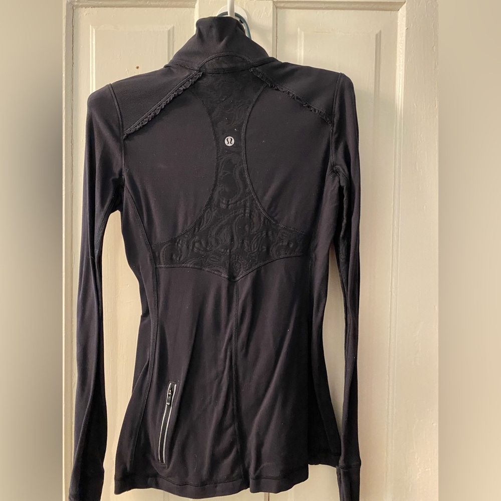 Lululemon black long sleeve half zip top. Sz XS. Lace detail on back and sleeves